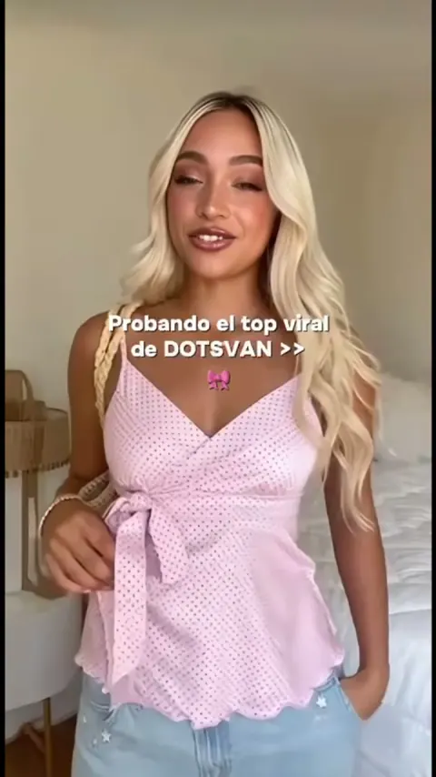 Dotsvan fashion ad showing a pink polka-dot top.